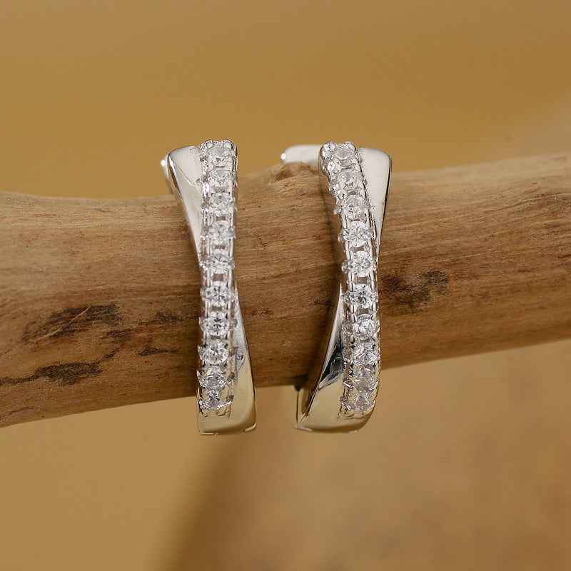 “Luxe Curve” 925 Sterling Silver Pavé Crossover Huggie Earrings - Image 5